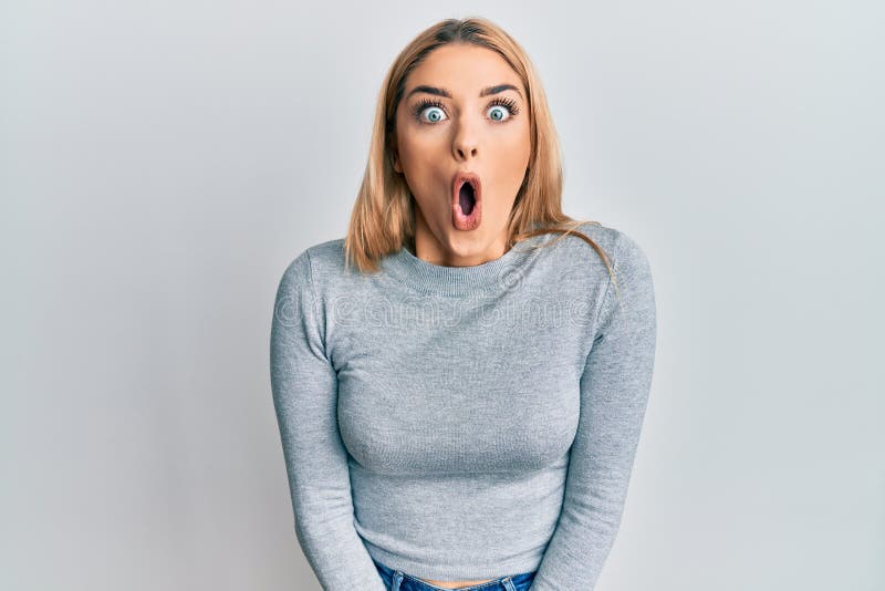 Young caucasian woman wearing casual clothes afraid and shocked with surprise expression, fear and excited face
