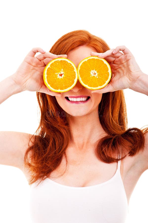 Young cheerful woman with oranges