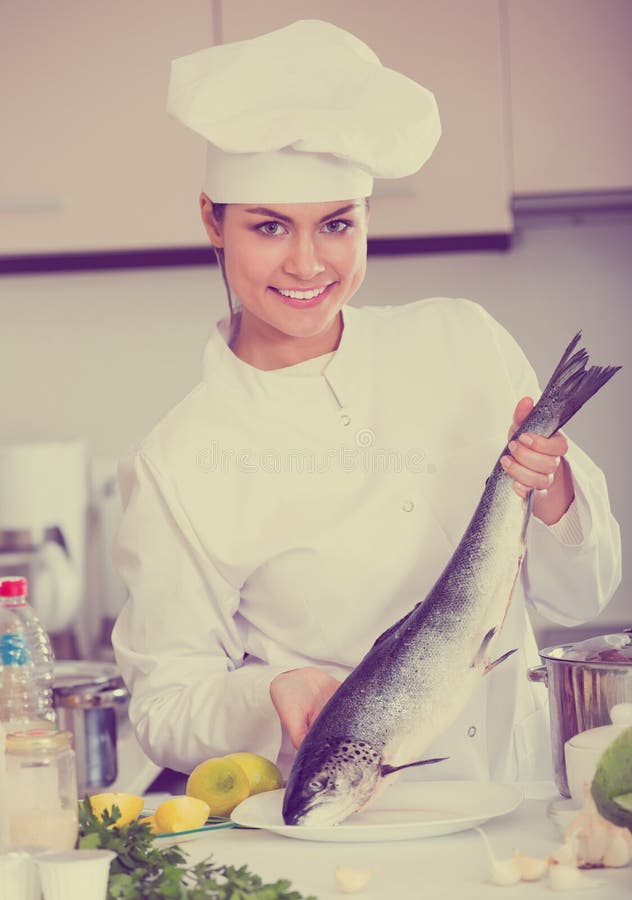 Young Chef Holding Carcass of Rainbow Trout Stock Image Image of