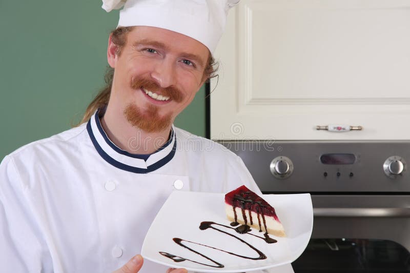 Young chef with piece of cake