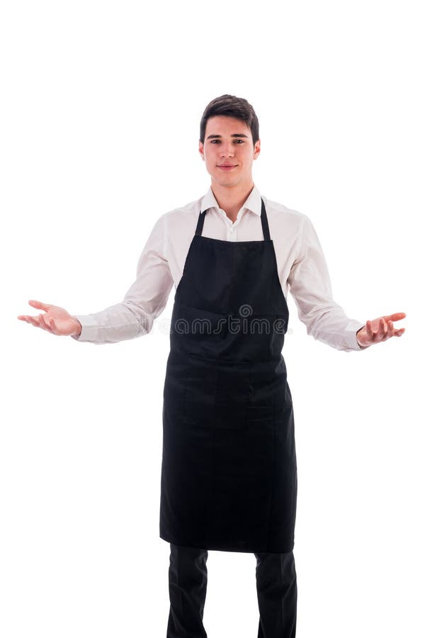 Young chef or waiter wearing black apron isolated