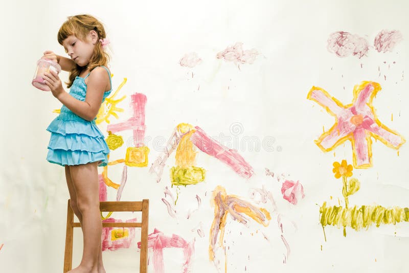 Young child girl painting over white