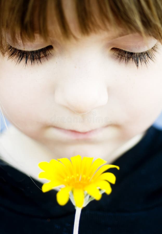 Young child holding flower