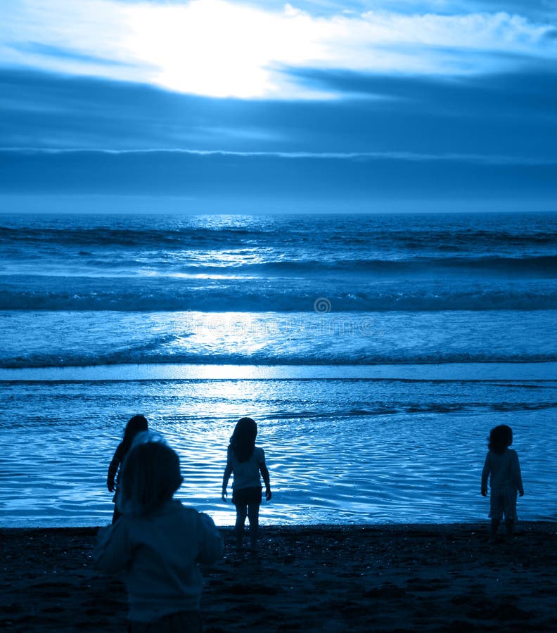 Young Children at Beach Looking Out into the Ocean