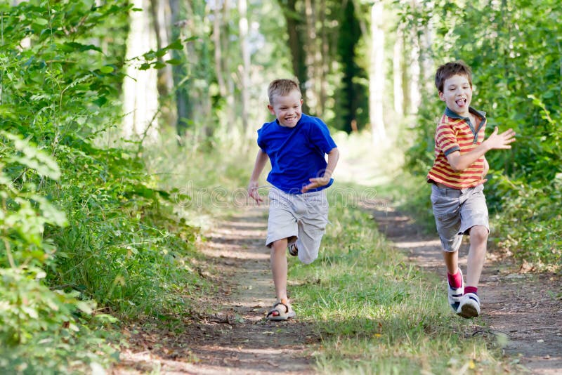 Young children running in nature. Young children running in nature