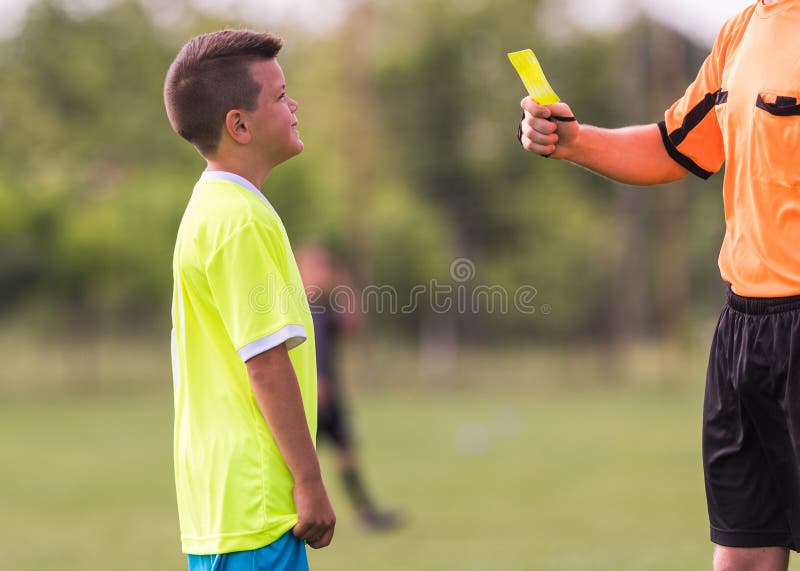 Young children player gets penalty in soccer game stock photography Young children player gets penalty in soccer game stock photography
