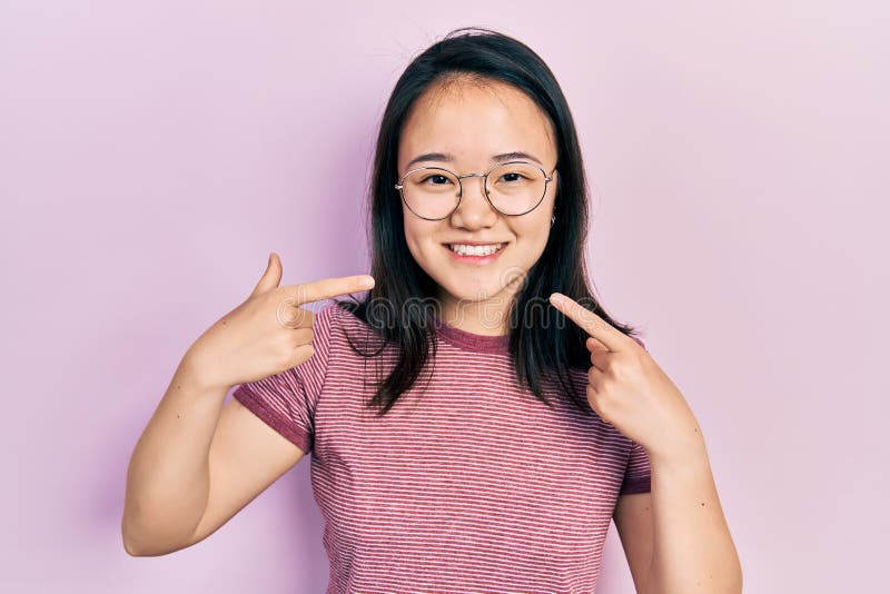 Young Chinese Girl Wearing Casual Clothes And Glasses Smiling Cheerful