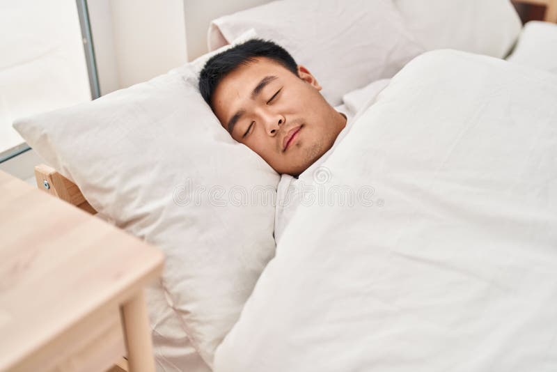 Young Chinese Man Lying on Bed Sleeping at Bedroom Stock Image Image