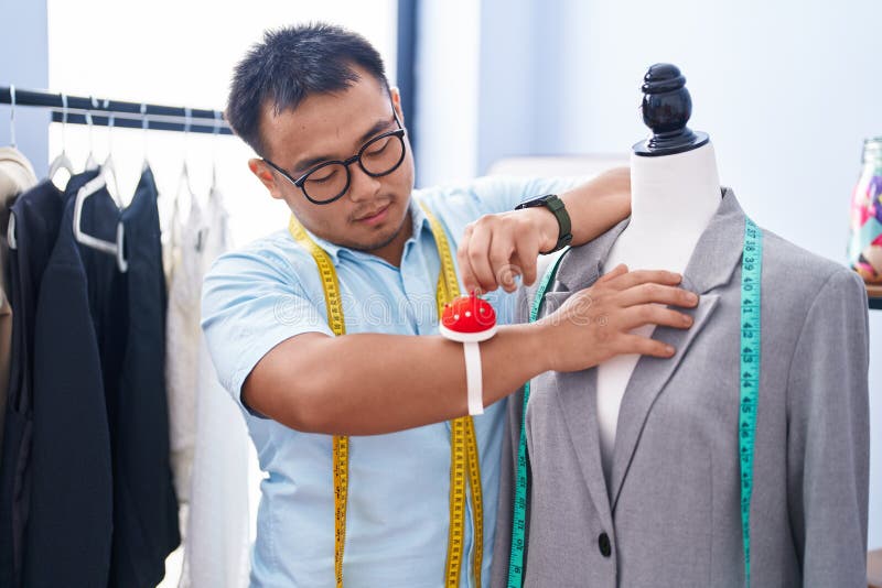 Young Chinese Man Tailor Measuring Jacket at Tailor Shop Stock Photo ...