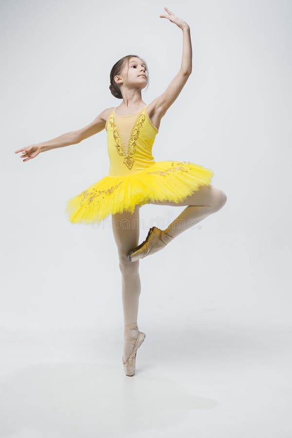 Young classical dancer on white background.