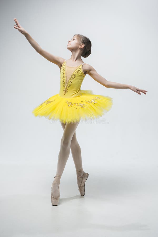 Young classical dancer on white background.