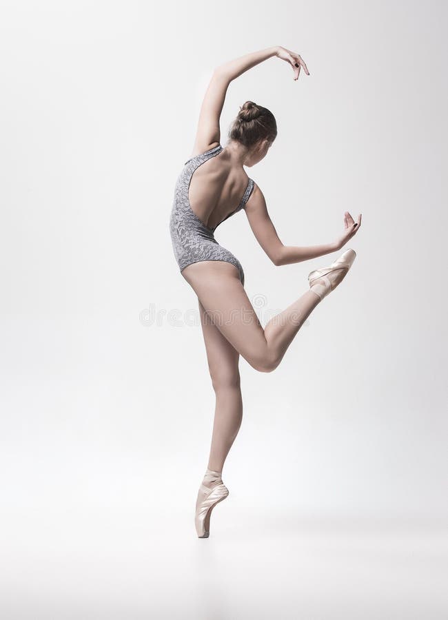 Young classical dancer isolated on white background. stock photo