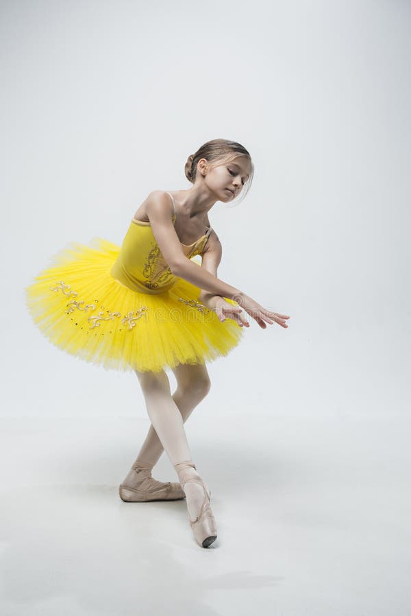 Young classical dancer on white background. stock photo