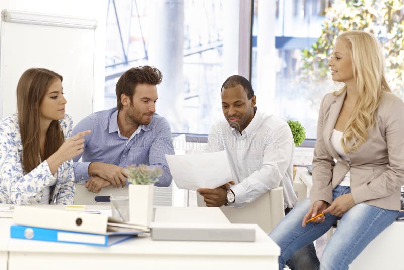 Young colleagues working together stock images