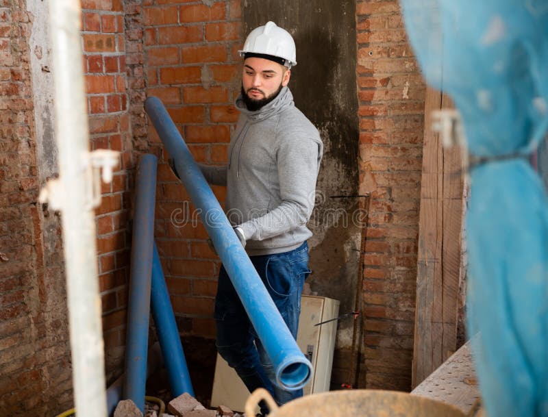 Plumber Preparing Plastic Pipes for Installation Stock Photo Image of