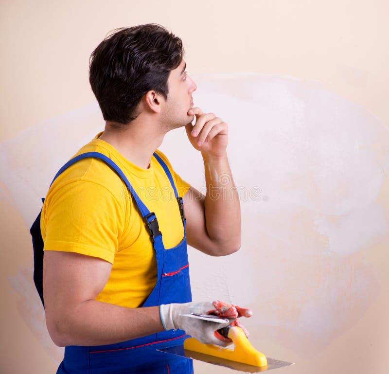 Young Contractor Employee Applying Plaster on Wall Stock Photo Image of coveralls, interior