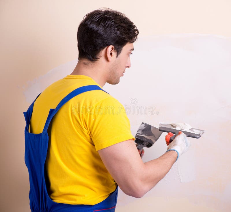 Young Contractor Employee Applying Plaster on Wall Stock Photo Image of contractor, builder
