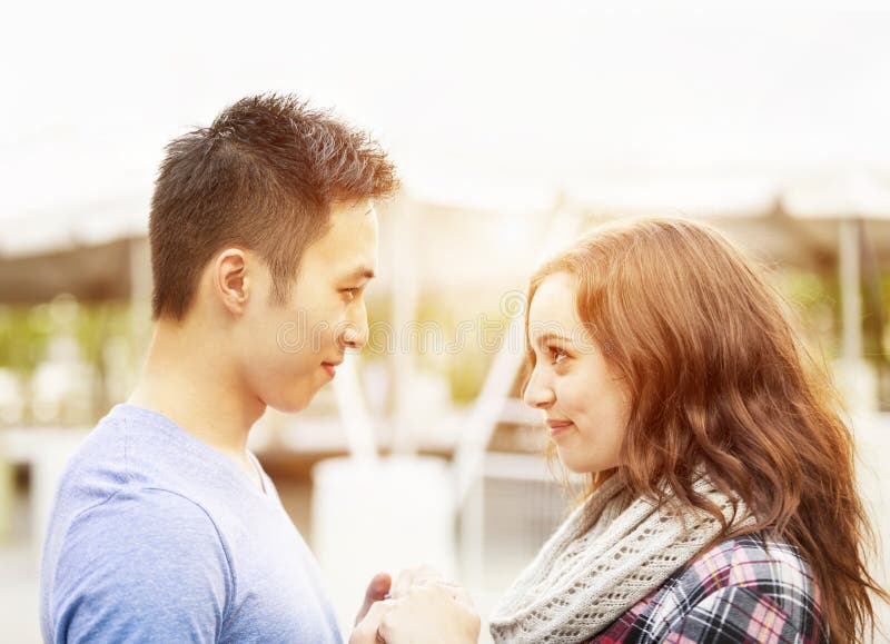 Premium Photo  Two young lovers. profiles of romantic couple looking at  each other