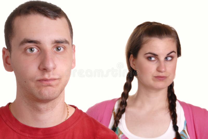 Young lady shouting at exasperated young man - humorous concept. Young lady shouting at exasperated young man - humorous concept