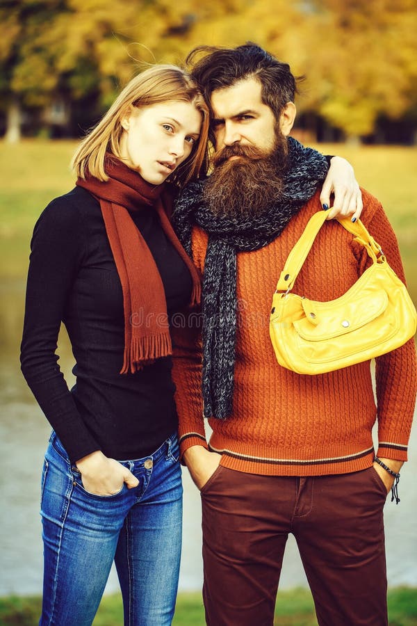 Young couple in autumn park stock photos Young couple in autumn park stock photos