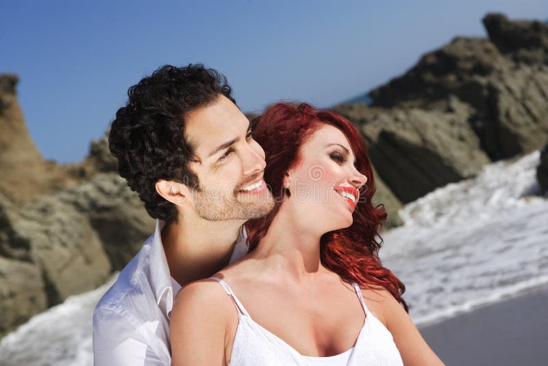 Young Couple at the beach showing affection