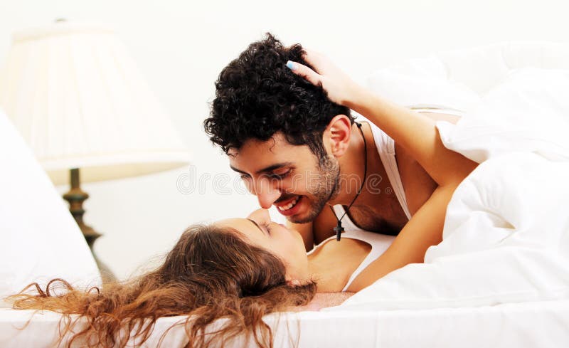 Young couple in bed stock photo