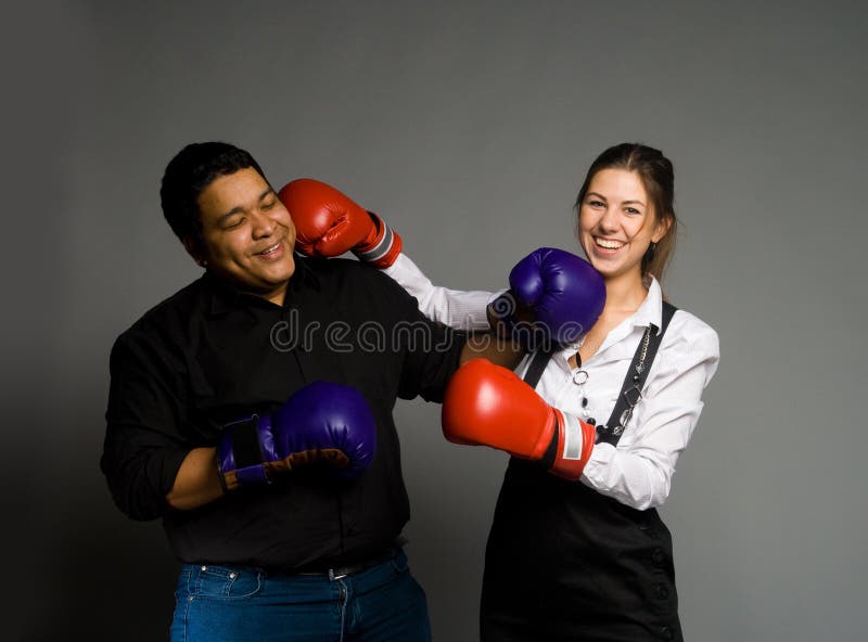 Young couple boxing and smiling