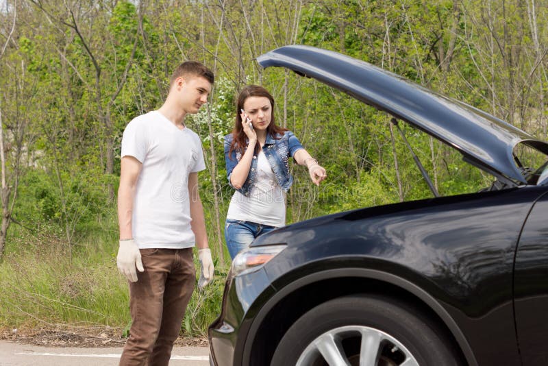 Young Couple Broken Down Side Road Photos - Free & Royalty-Free Stock Photos from Dreamstime