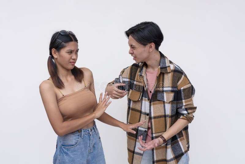Young couple in casual clothes having a heated discussion royalty free stock photo