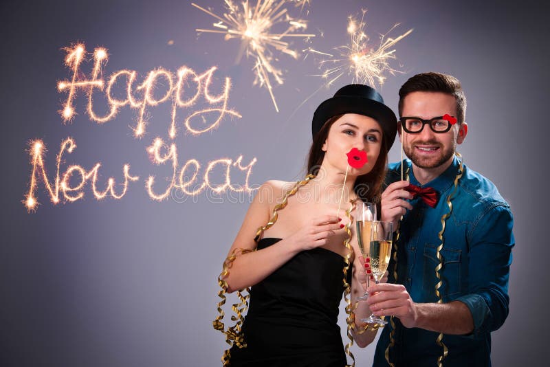 Young couple with champagne flutes stock photo Young couple with champagne flutes stock photo