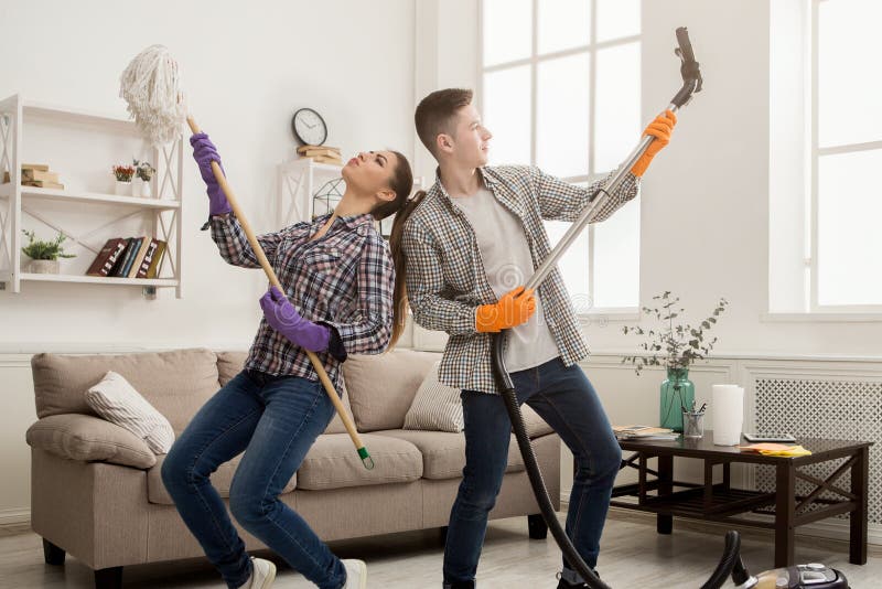 Young Couple Cleaning Home Having Fun Stock Image Image Of