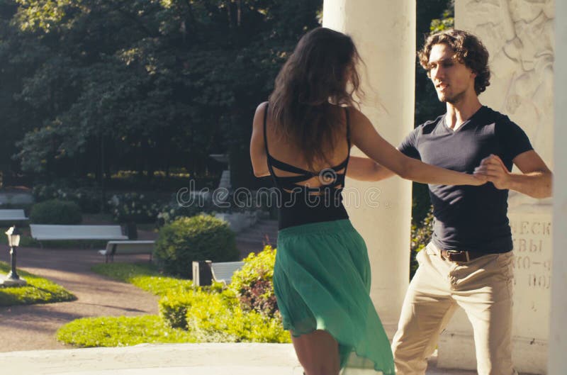 Young couple dancing in the park stock images Young couple dancing in the park stock images
