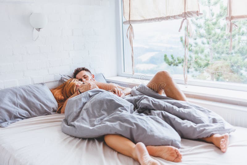 Young Couple Enjoying Bed Time In The Morning Stock Image