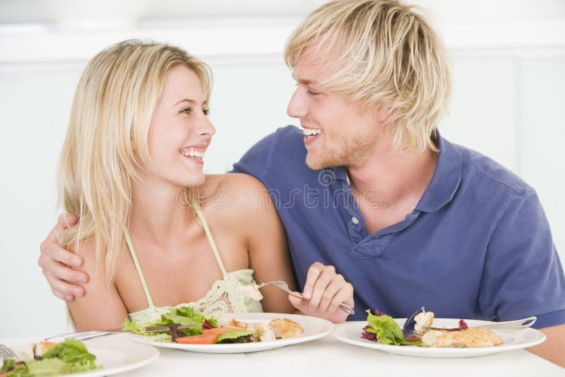 Young Couple Enjoying Meal royalty free stock image
