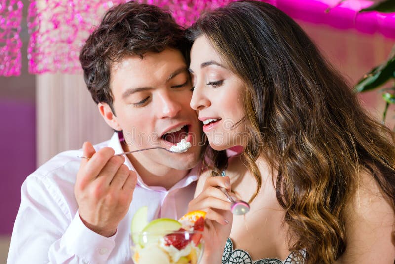 Young couple enjoying their time in ice cream parlor