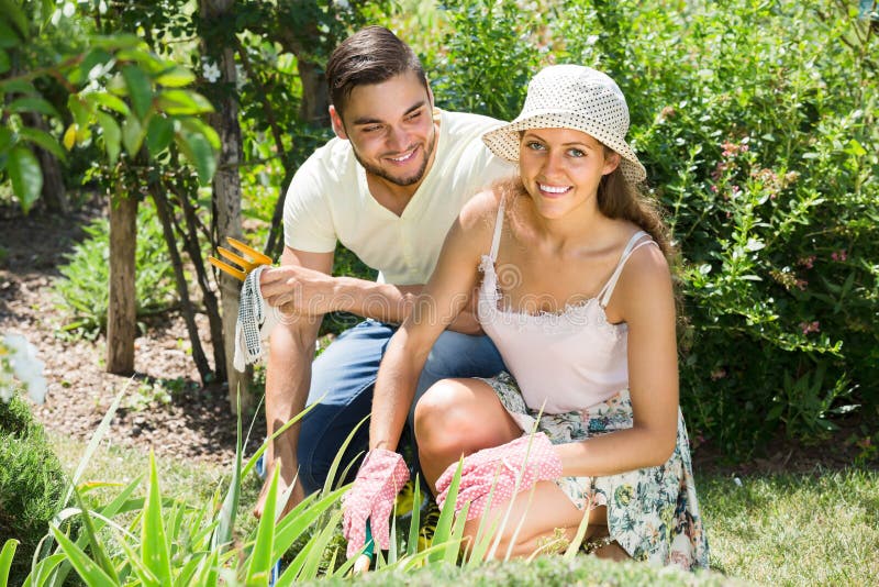 Young Couple Gardening Together Stock Image - Image of care, casual ...