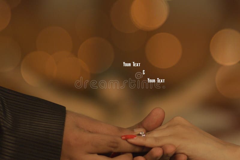 Young Couple Hand in Hand in Engagement Ring Ceremony Stock Photo