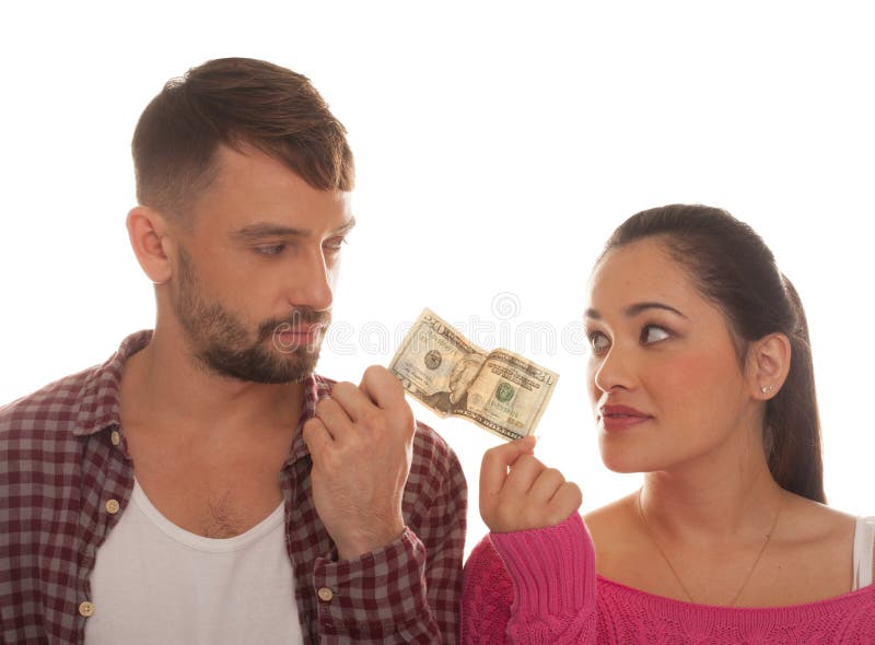 Young couple holding a twenty US dollar bank note