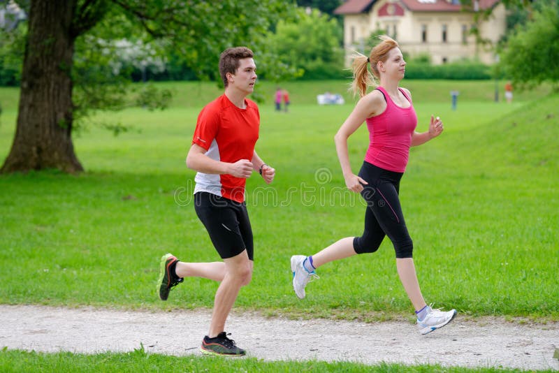 Young couple jogging in park royalty free stock image Young couple jogging in park royalty free stock image