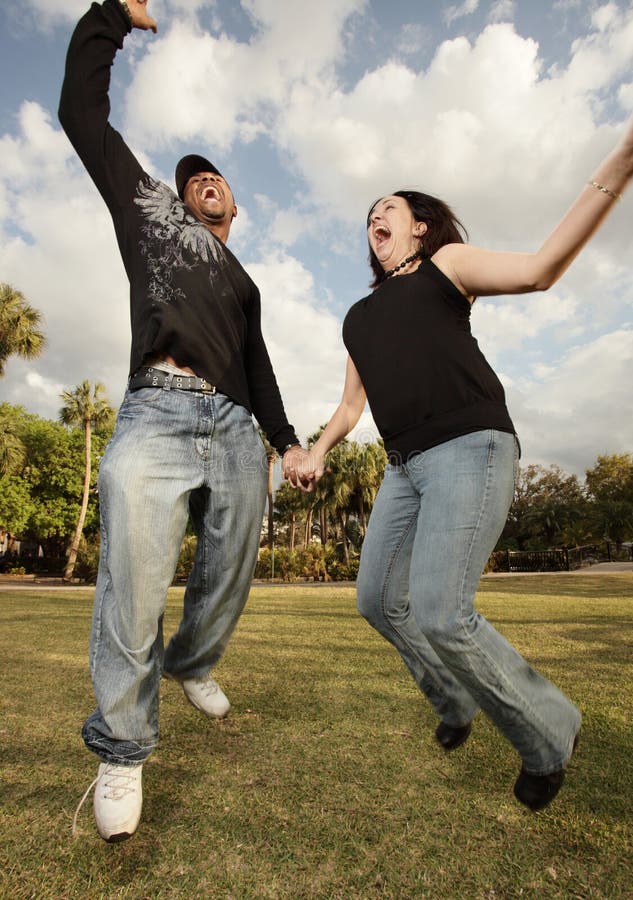 Young couple jumping in the air