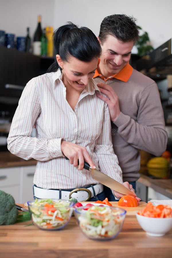 Young couple in kitchen royalty free stock photo