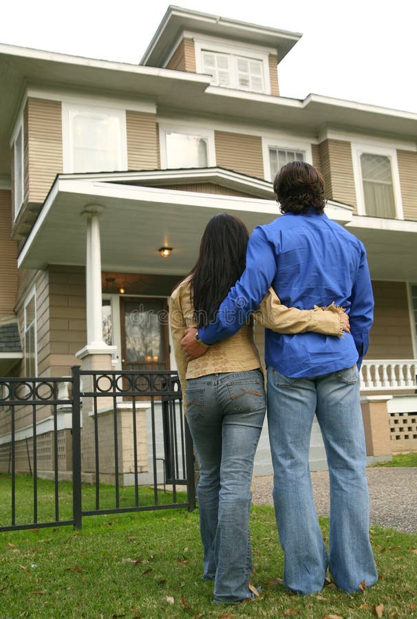 Young Couple Looking At House