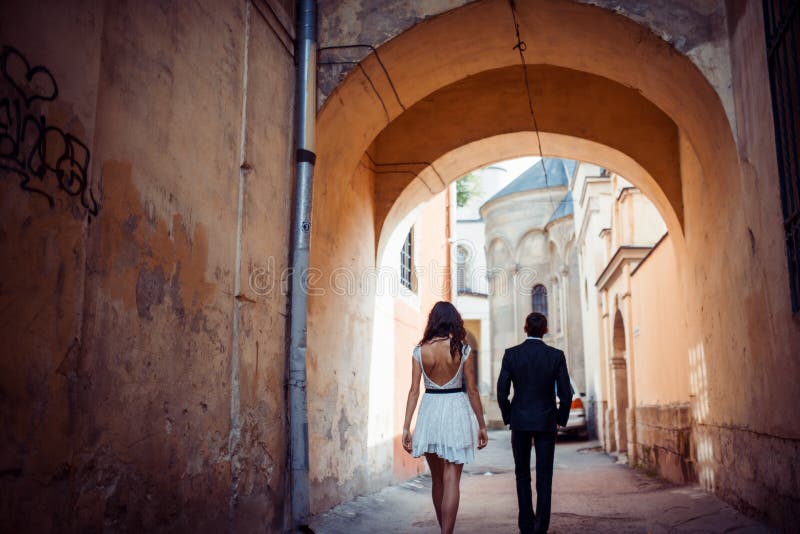 Young couple in love, hugging in the old part of town