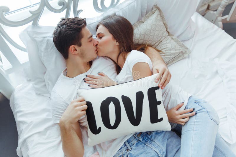 young-couple-love-kissing-hugging-bed-bedroom-celebrating-saint-valentin-s-day-home-together-valentines-268179067.jpg