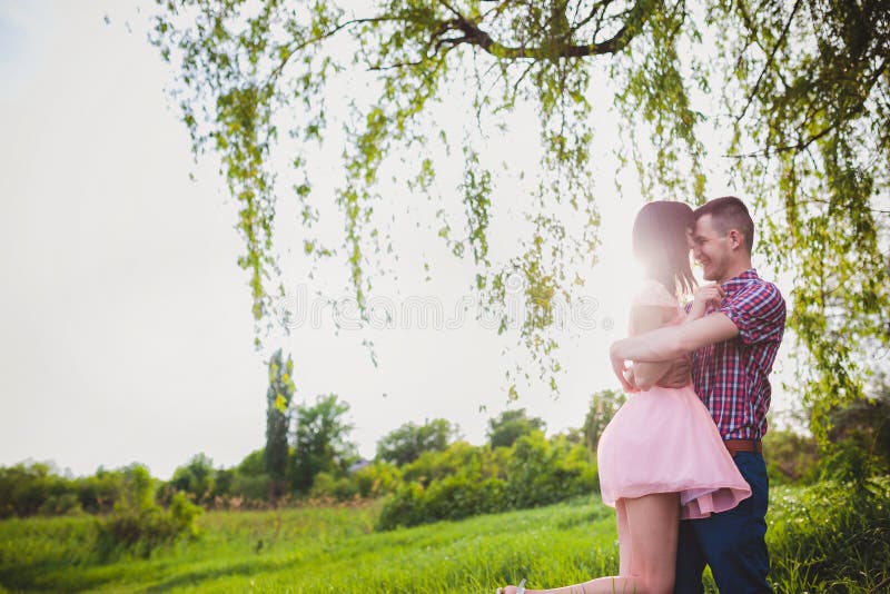 young couple in love together on nature