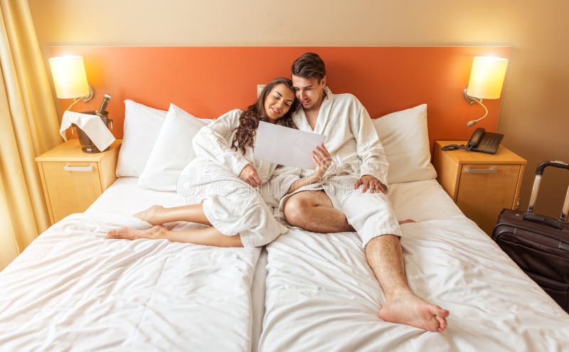 Young Couple Lying In The Bed Of A Hotel Room Stock Photo Image Of
