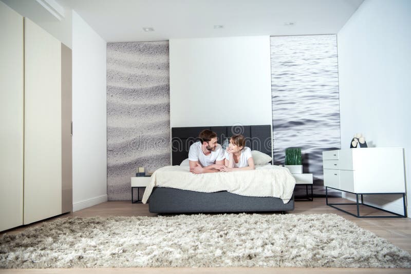 Young couple lying in bedroom royalty free stock photo Young couple lying in bedroom royalty free stock photo