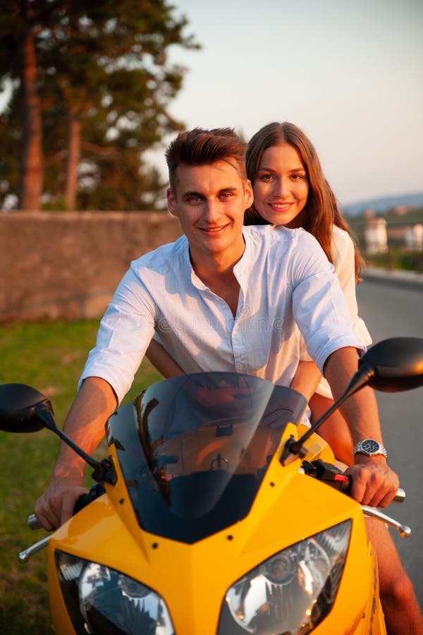 Young Couple on a Motor Bike on a Late Summer Afternoon Stock Photo ...