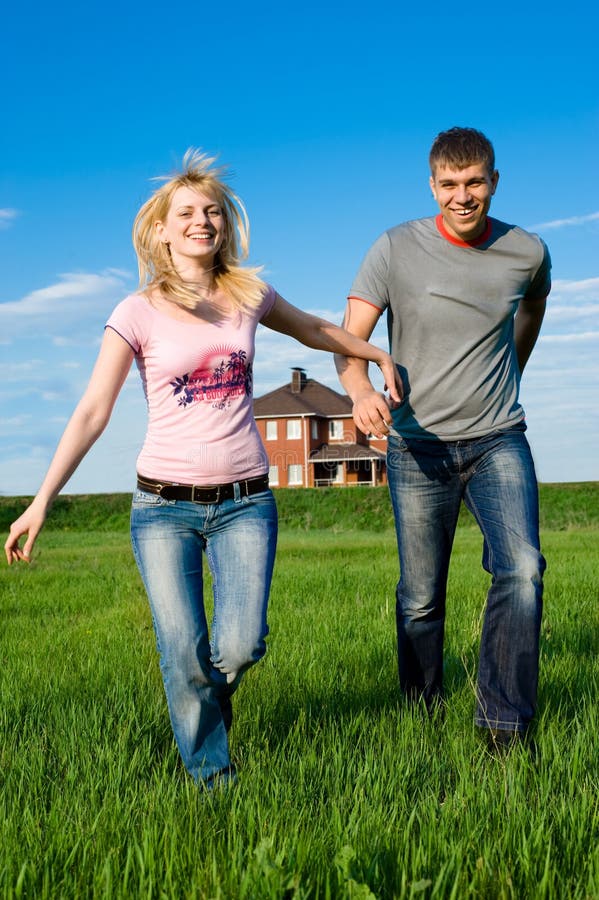 Young couple outside their home