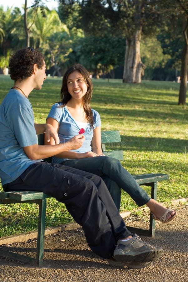 Young Couple on a Park Bench -- Vertical